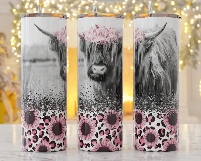 Highland cow with pink flowers